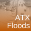 "ATX Floods" text over an image of cars backed up on a flooded roadway.