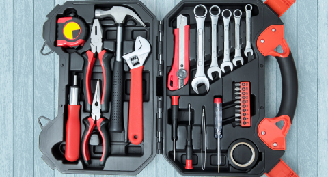 Opened toolbox full of wrenches