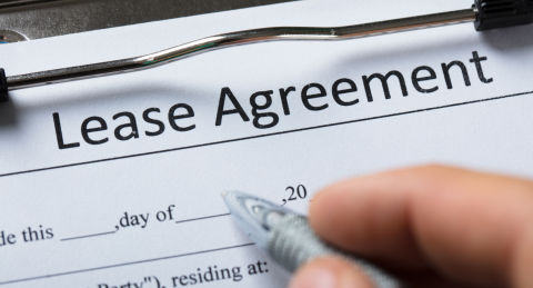 Lease agreement on a clipboard
