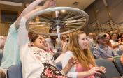 Students playing with a wheel in a physics circus