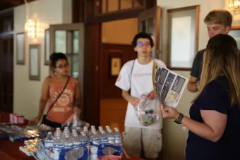 Students putting together care bags at 7 Minute Service