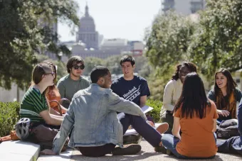 Students sitting on the ground