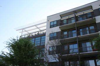 Apartment building, sun in background