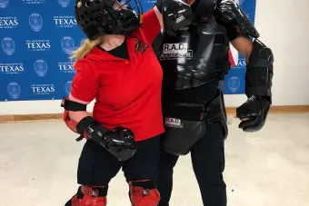 Two people practicing self defense