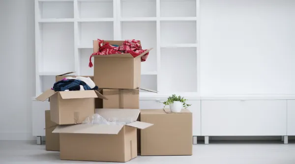 Packed moving boxes stacked in an empty apartment