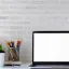 Laptop on a desk with a white background