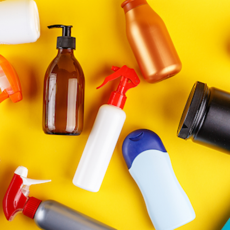 Cleaning bottles on a yellow background